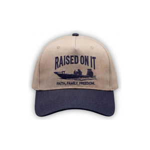 Outboard Legacy Hat in Skiff (navy brim, navy stitch) with embroidered Raised On It skiff logo and Faith Family Freedom